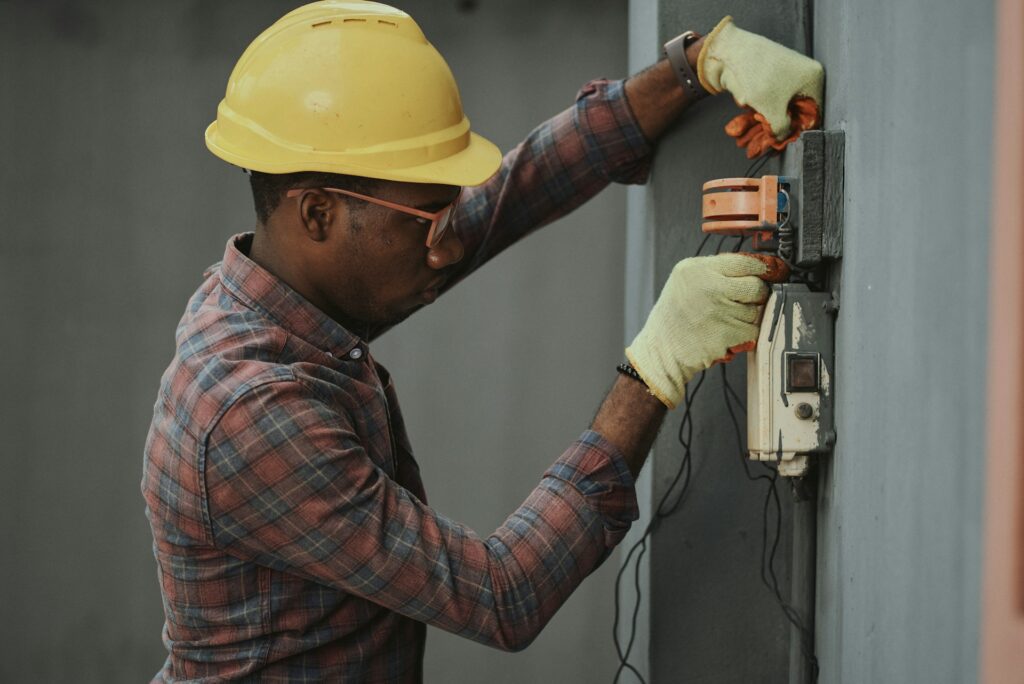 Worker is doing electrical work